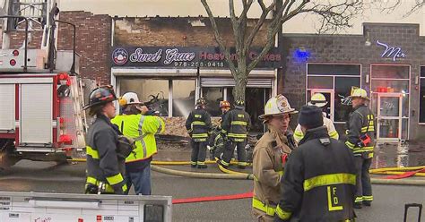 Crews battle raging fire at Lawrence liquor store, bakery